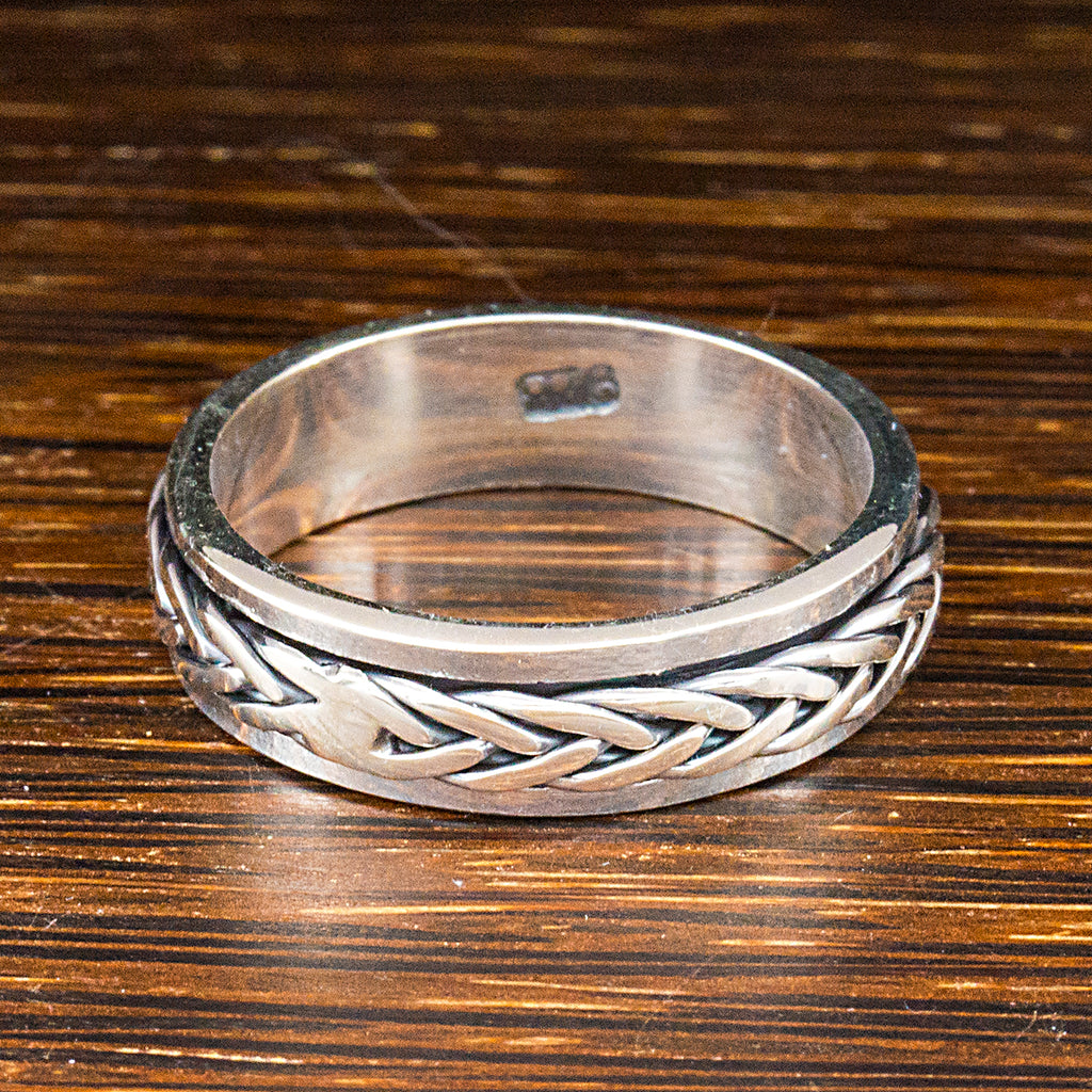 sterling silver spinning ring with plaited band detail