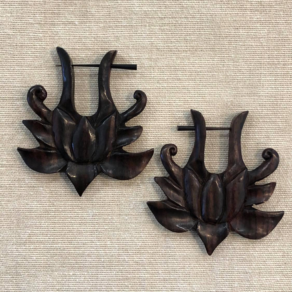 Two rosewood earrings featuring a lotus flower design