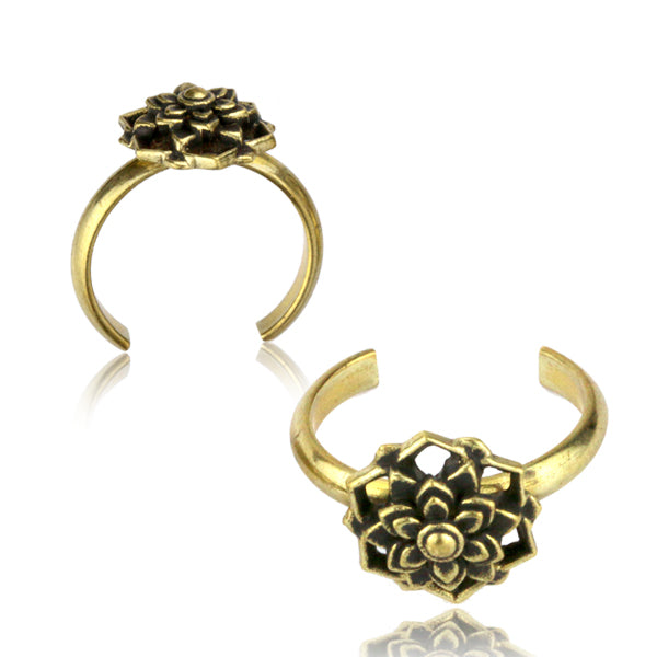Two brass toe rings featuring a mandala flower design on a white background