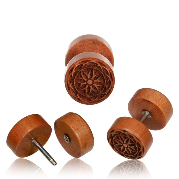 Three rose wood fake plugs featuring a flower of life symbol