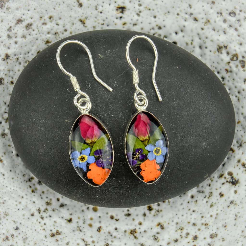 san marco almond shaped silver and resin earrings with various coloured dried flowers encased in the resin