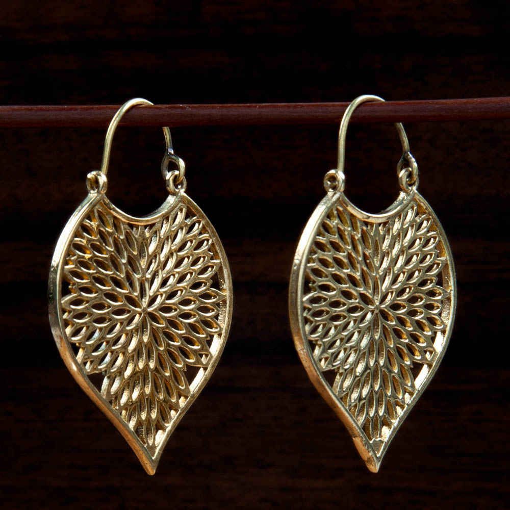 Two brass earrings featuring a drop shape