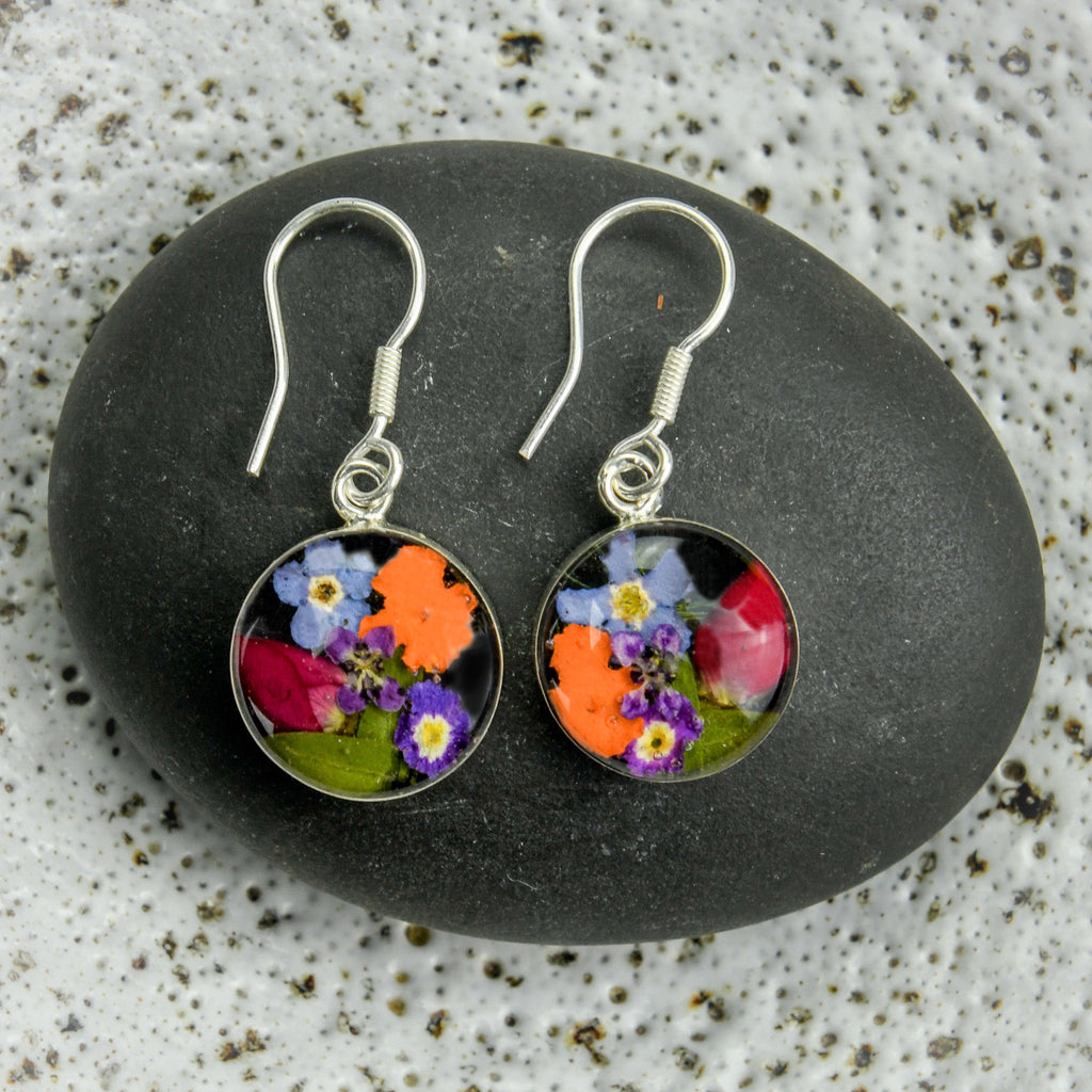 san marco small round silver and resin earrings with various coloured dried flowers encased in the resin