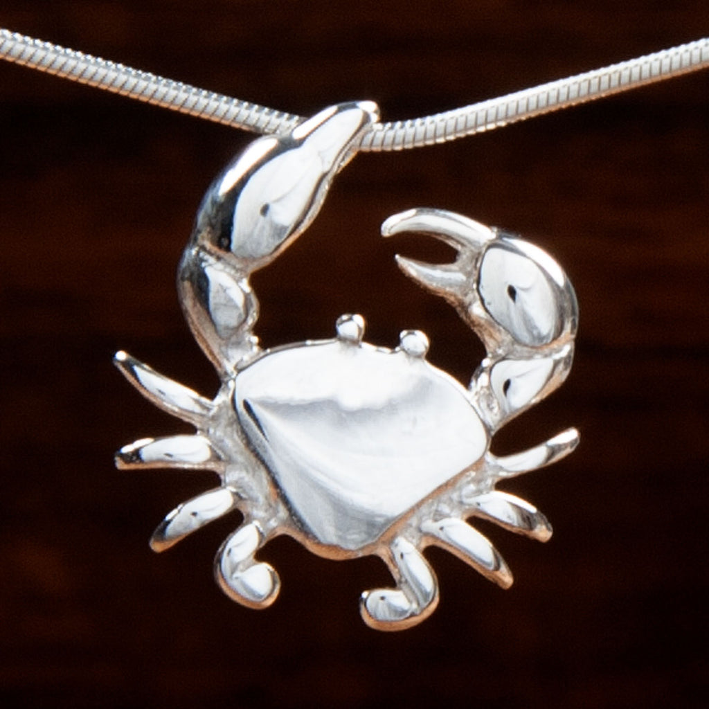 Sterling silver crab pendant with claw holding necklace