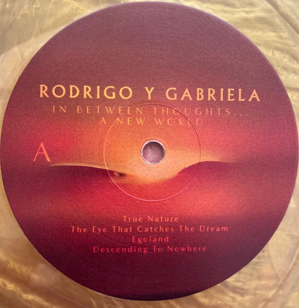 Rodrigo Y Gabriela : In Between Thoughts​.​.​. A New World (LP, Gol)