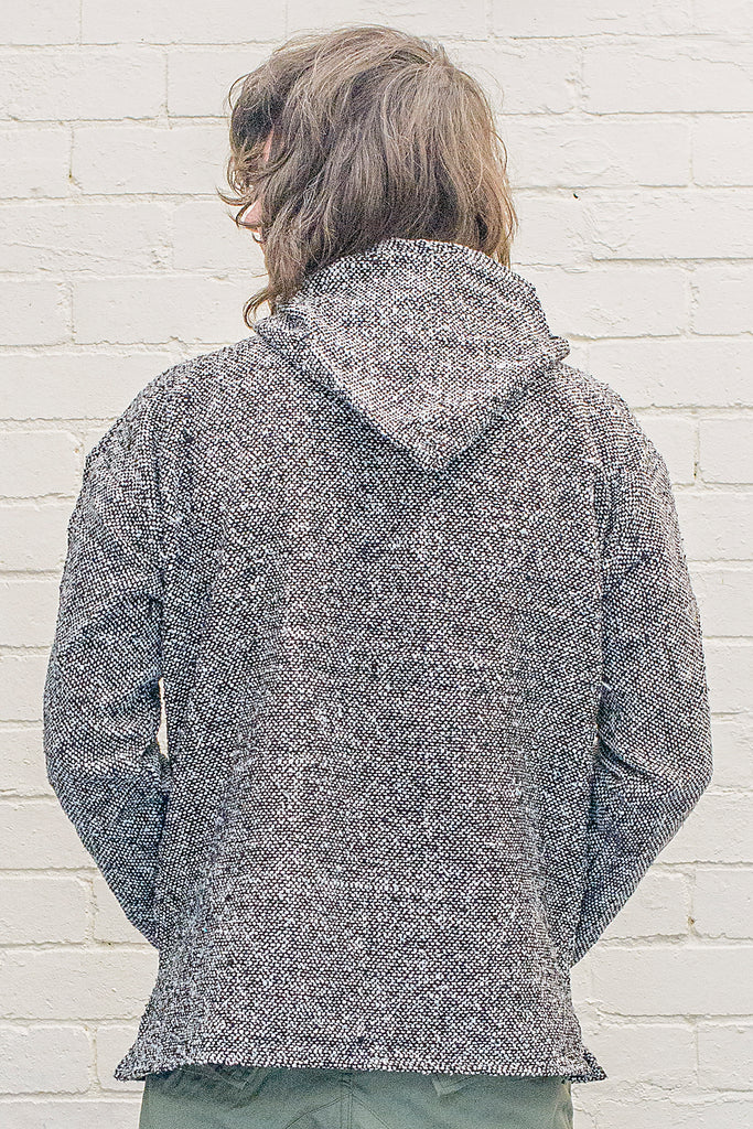 Model wearing a Charcoal Baja Hoodie from the back