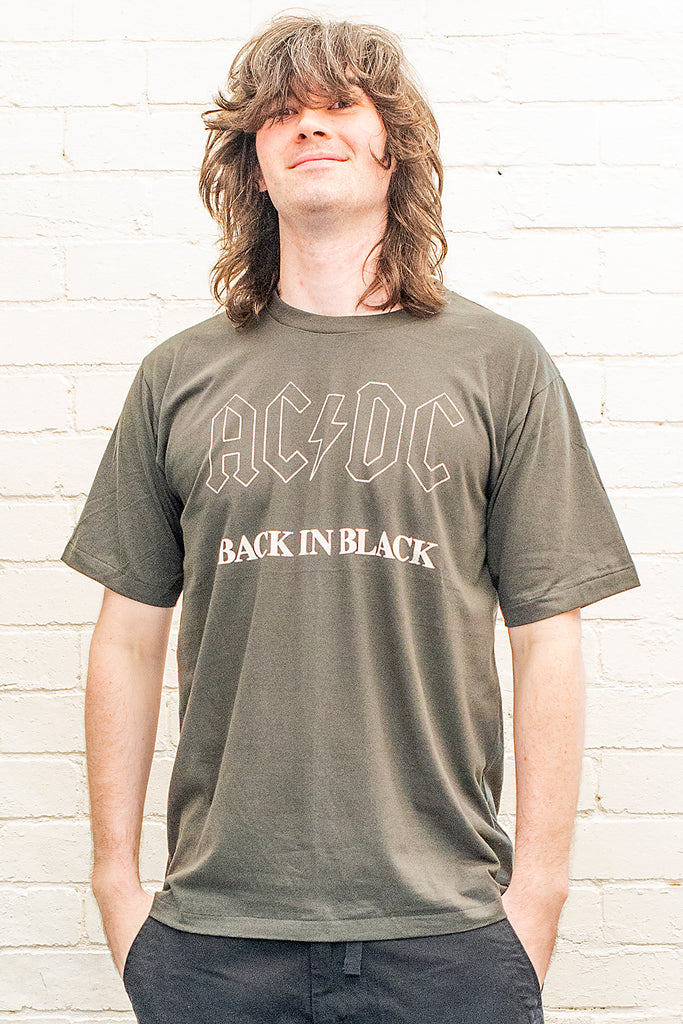 model wearing black cotton t-shirt with ac/dc back in black print on front