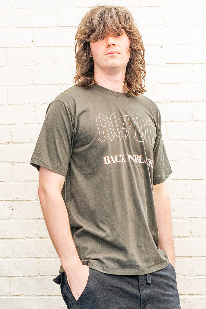 model wearing black cotton t-shirt with ac/dc back in black print on front