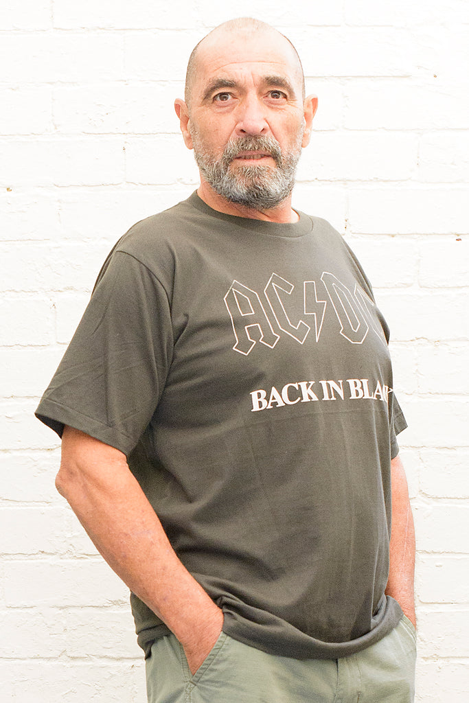 model wearing black cotton t-shirt with ac/dc back in black print on front