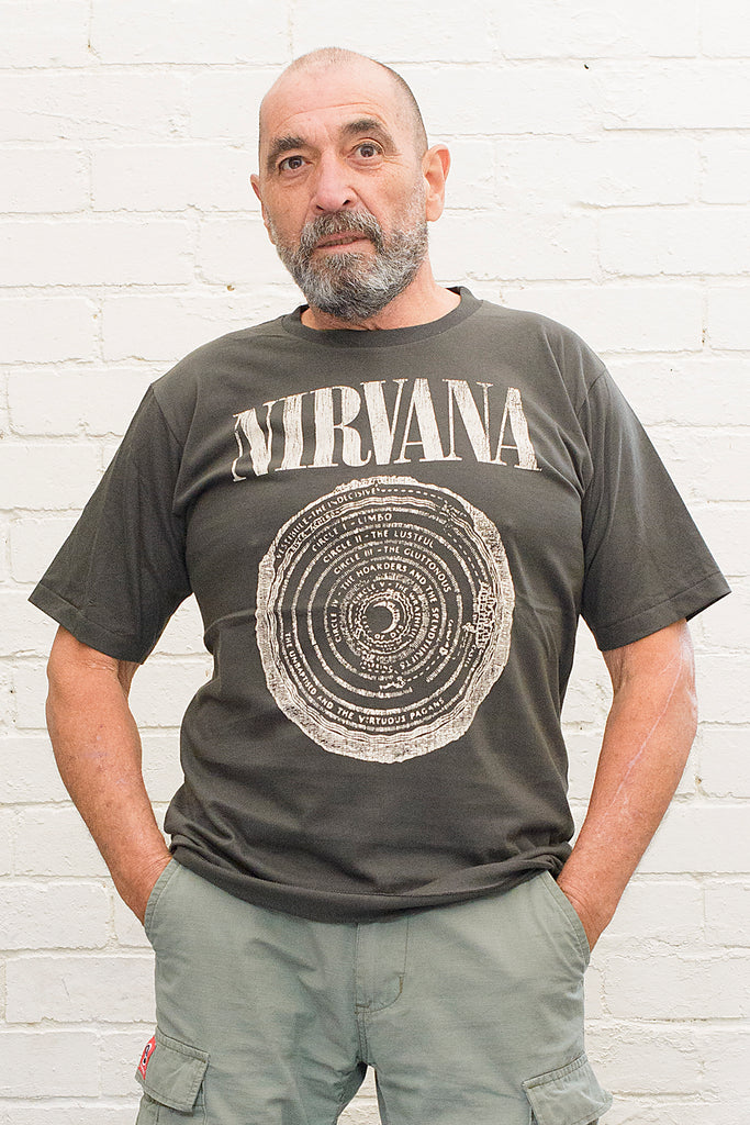 model wearing black cotton t-shirt with Nirvana logo and circle of hell graphic printed on front