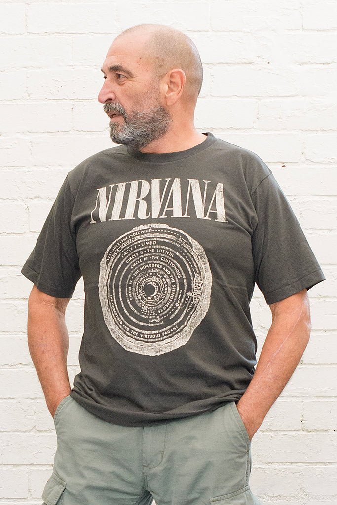 model wearing black cotton t-shirt with Nirvana logo and circle of hell graphic printed on front