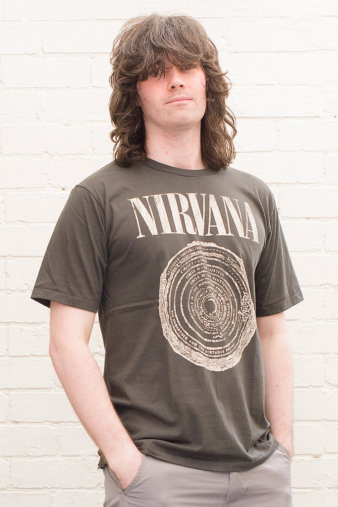 model wearing black cotton t-shirt with Nirvana logo and circle of hell graphic printed on front