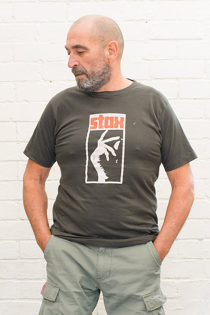 model wearing black cotton t-shirt with stax record label logo printed on front