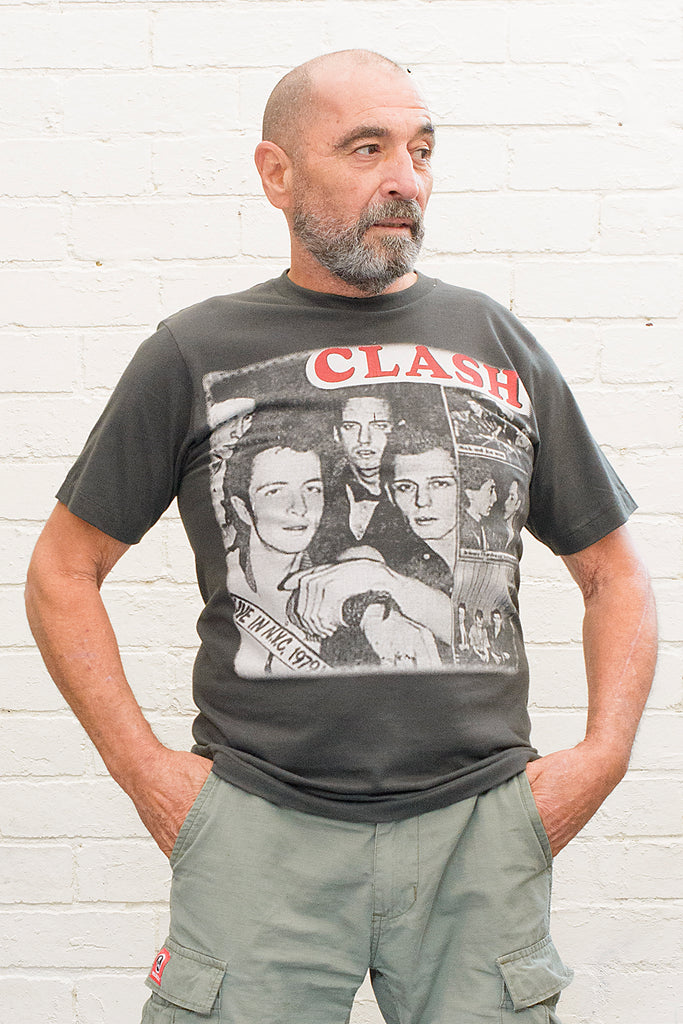 model wearing black cotton t-shirt with the clash lettering printed atop photographic images of the band in album cover format front