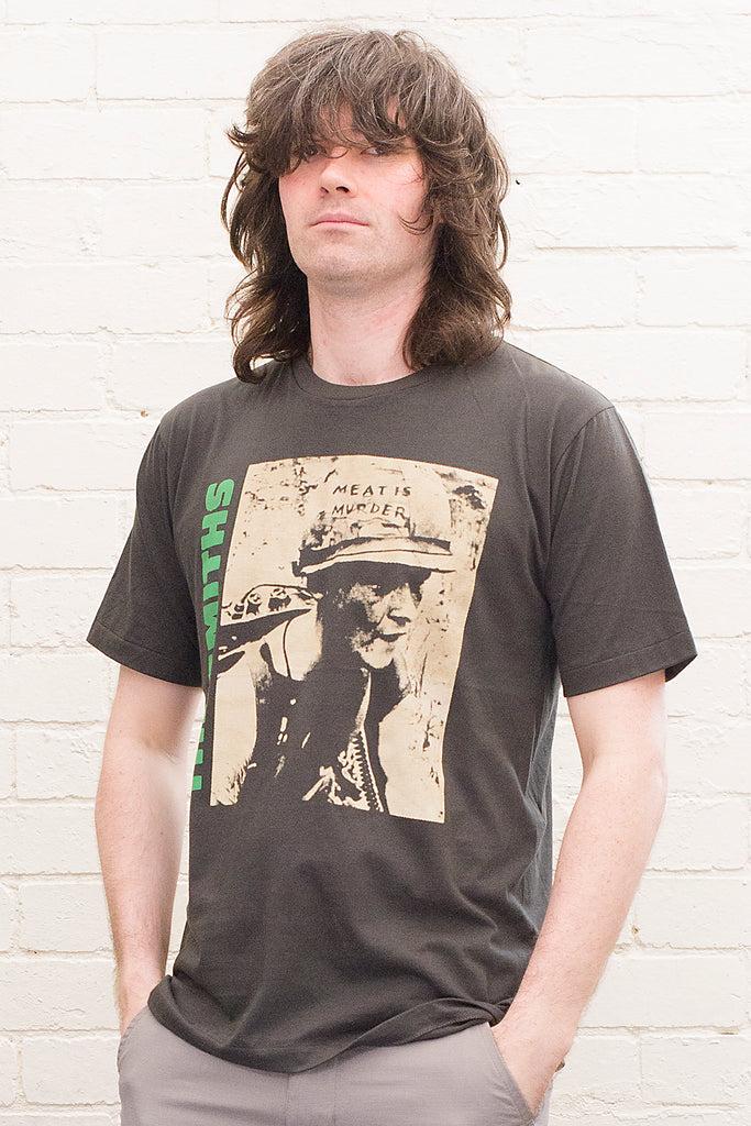 model wearing black cotton t-shirt with the smiths meat is murder album cover printed on the front