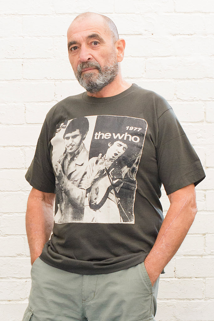 model wearing black cotton t-shirt with black and white photographs of the who and the text the who 1977 printed on the front