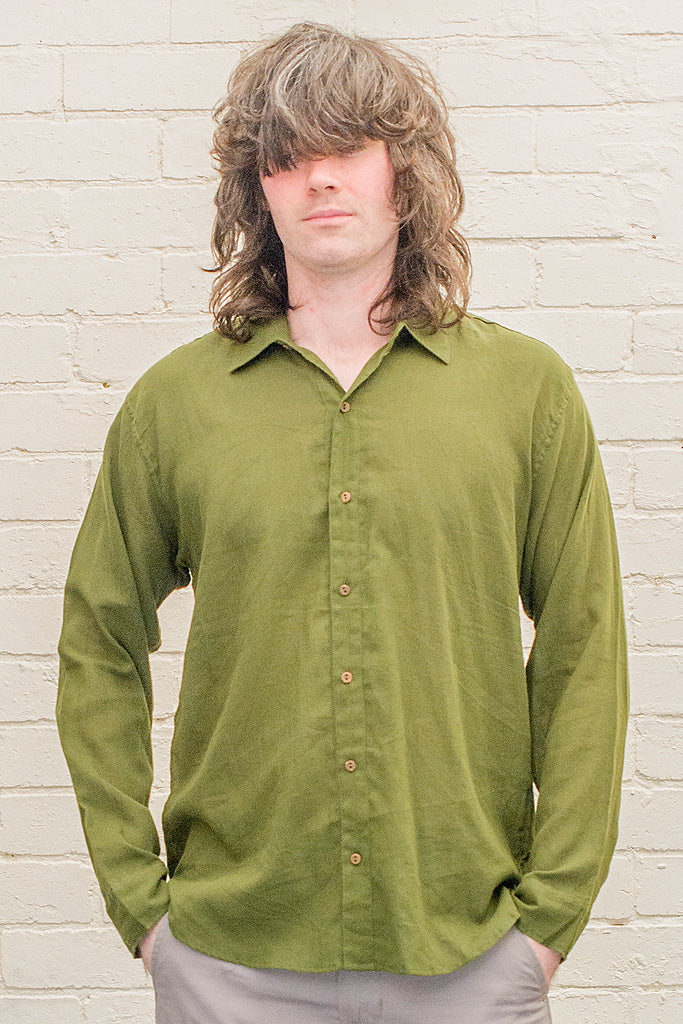 model wearing green cotton button up long sleeved collared shirt from the front