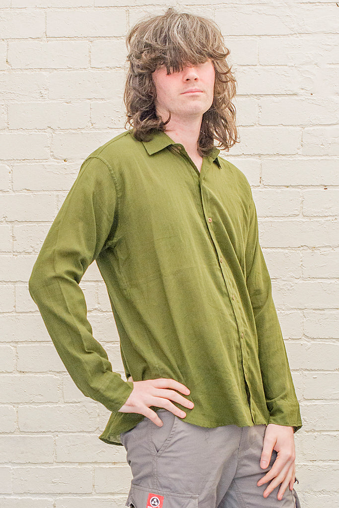 model wearing green cotton button up long sleeved collared shirt from the front