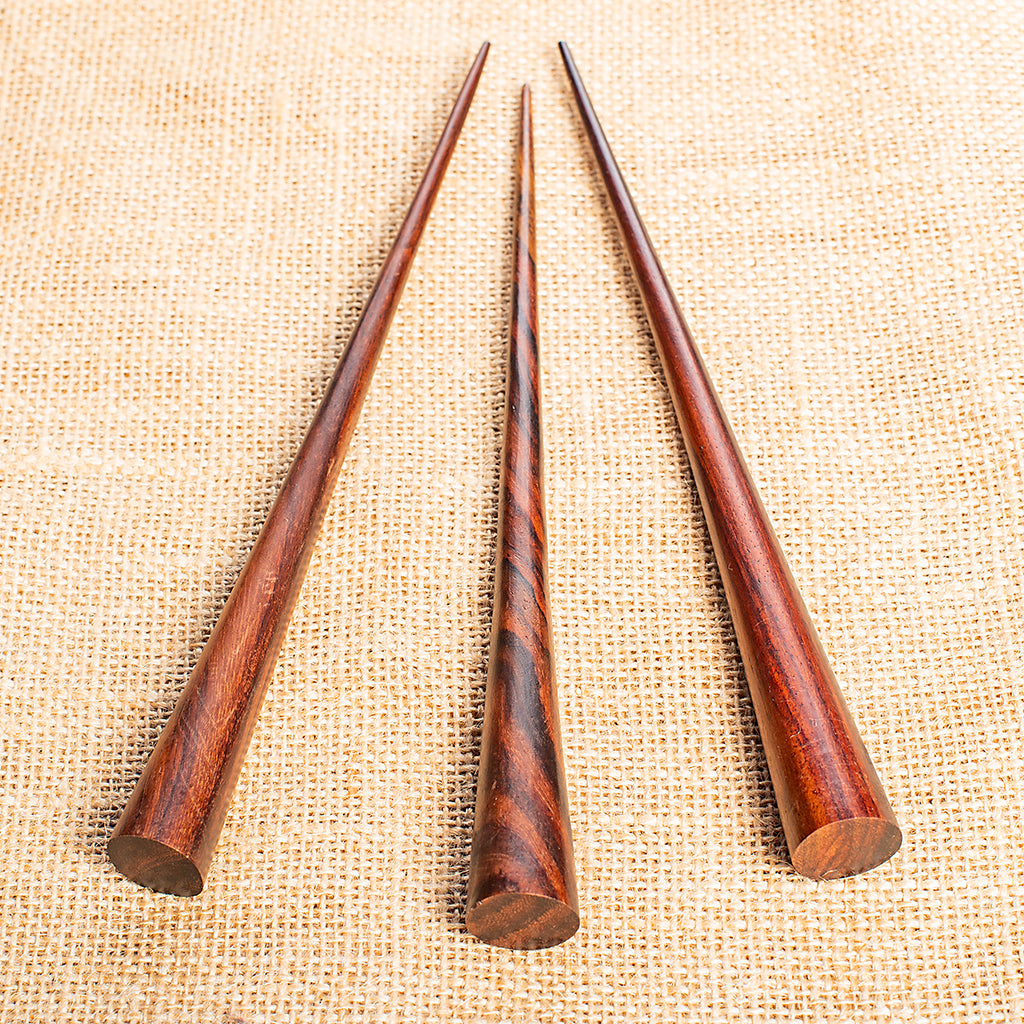 slender conical wooden hair stick with flat end
