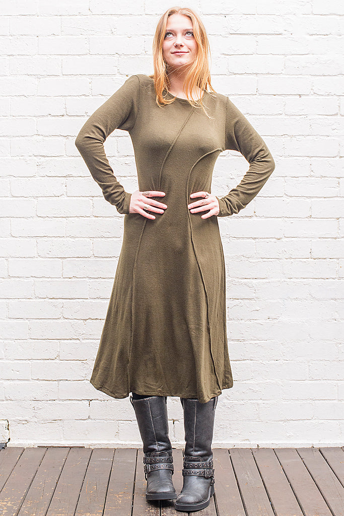 Model wearing a Marzanna midi length knit dress in army green