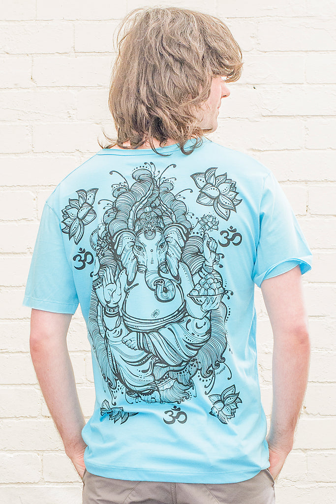 model wearing a bright blue T-shirt featuring a ganesh line drawing design printed in black on the back