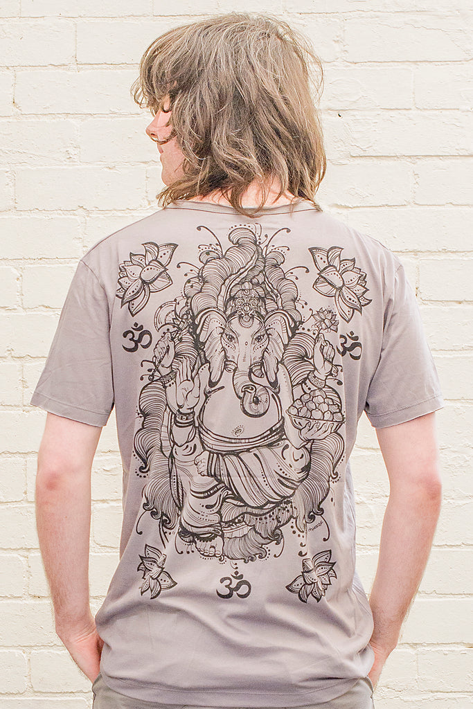 model wearing a grey T-shirt featuring a ganesh line drawing design printed in black on the back