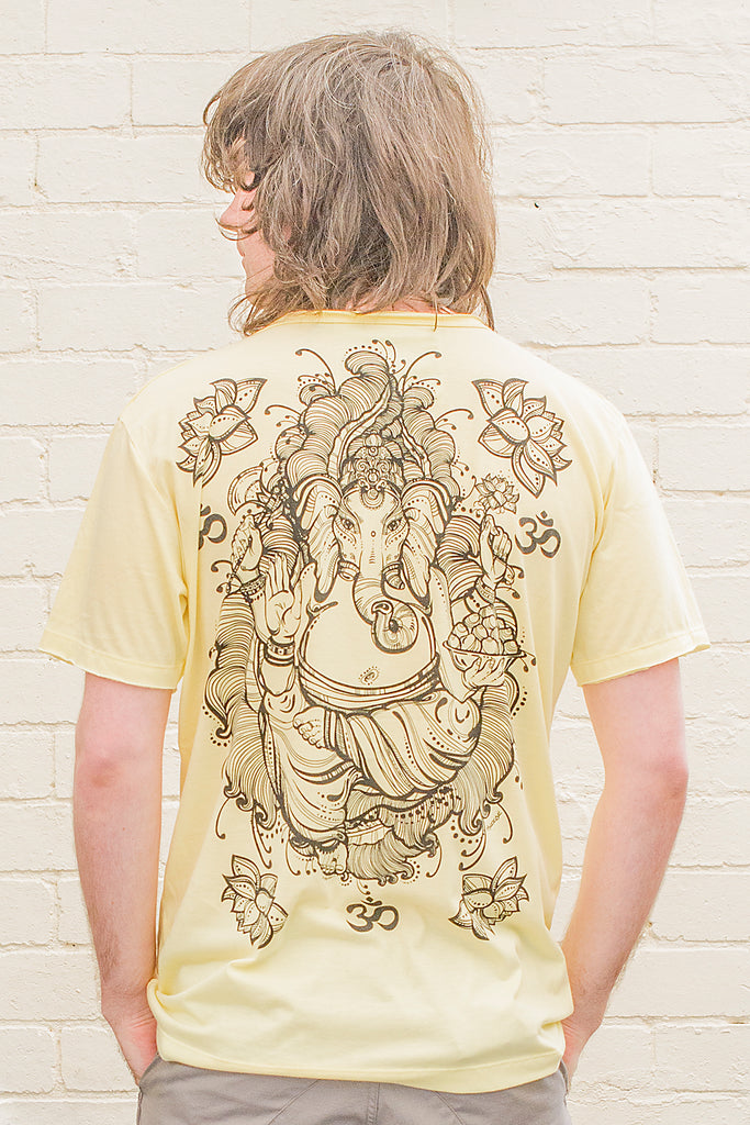 model wearing a yellow T-shirt featuring a ganesh line drawing design printed in black on the back