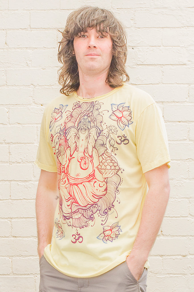 model wearing a yellow T-shirt featuring a colourful ganesh line drawing design printed on the front in blue red and purple tones