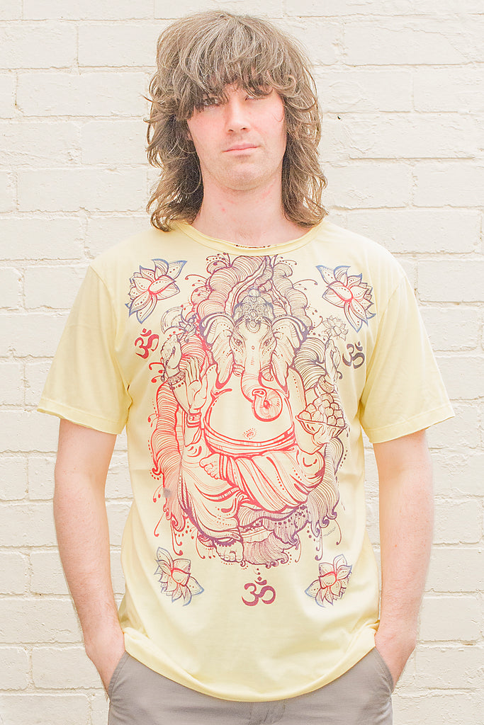 model wearing a yellow T-shirt featuring a colourful ganesh line drawing design printed on the front in blue red and purple tones