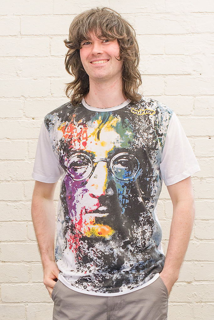 model wearing a white t-shirt with a painterly portrait of john lennon printed on the front