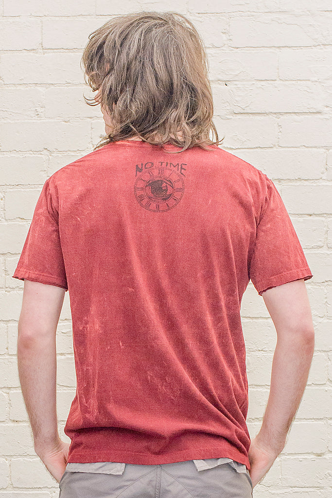 model wearing a dark red or maroon stonewash t-shirt printed with the no time brand logo on the back