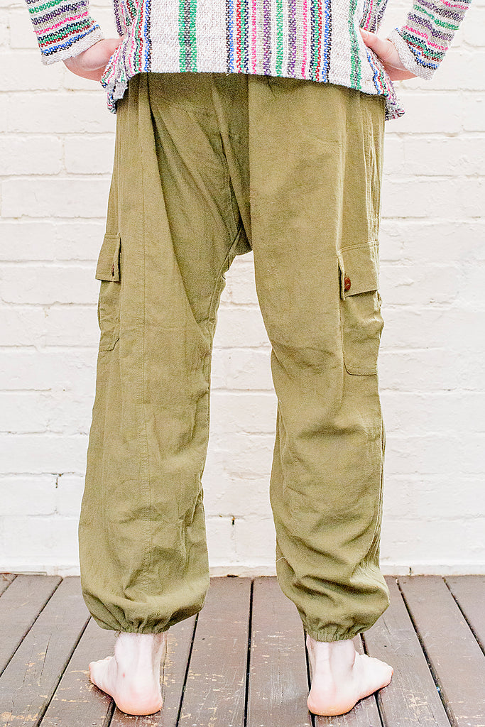 model wearing full length odyssey pants in green from back