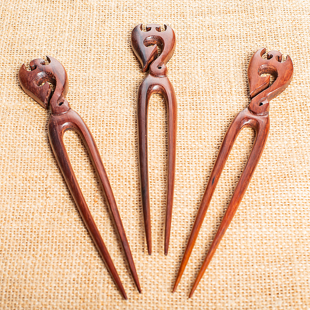 hand carved wooden double prong hair stick with phoenix motif at end