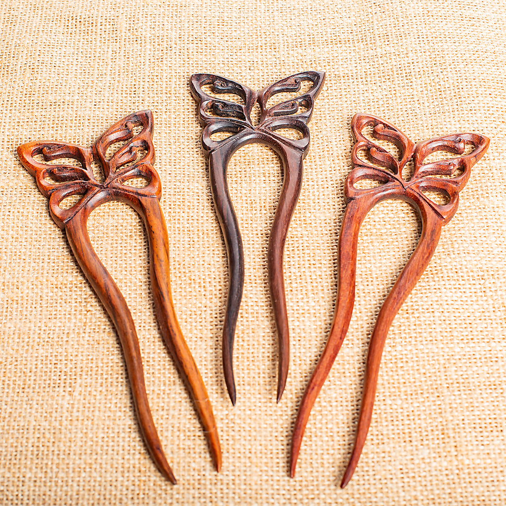 hand made wooden double prong hair stick with ornate butterfly carving at end