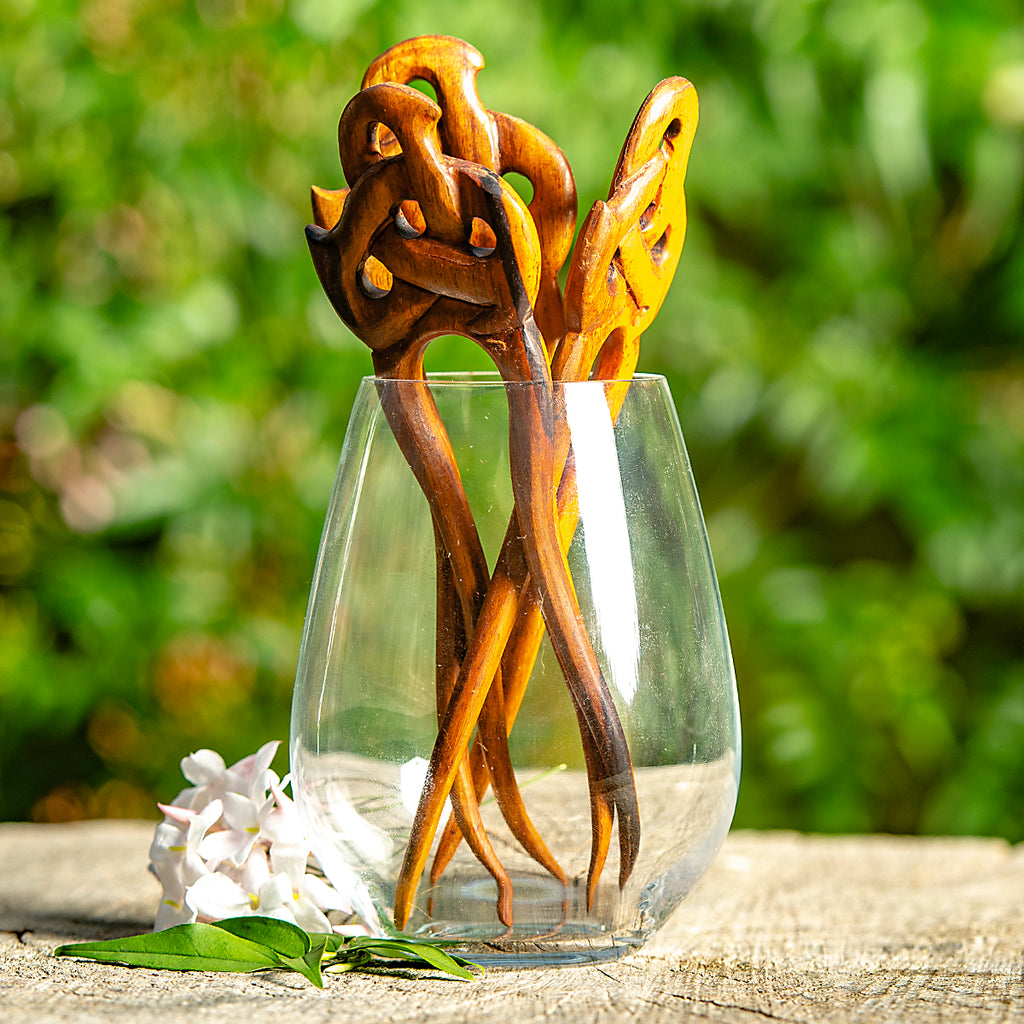 hand made wooden double prong hair stick with celtic knot carved at end