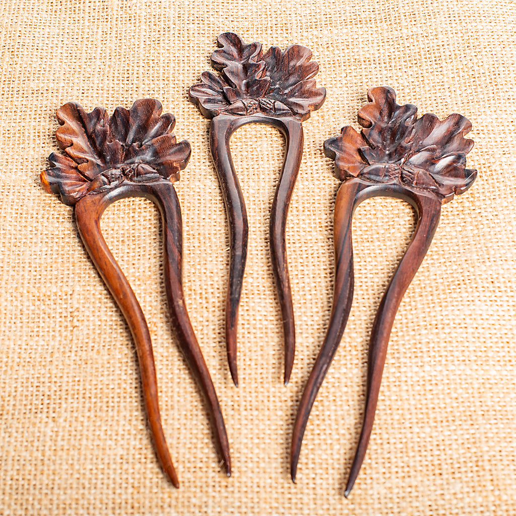 hand made wooden double prong hair stick with classic oak leaf design carved at end