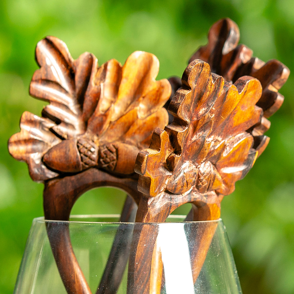 hand made wooden double prong hair stick with classic oak leaf design carved at end detail