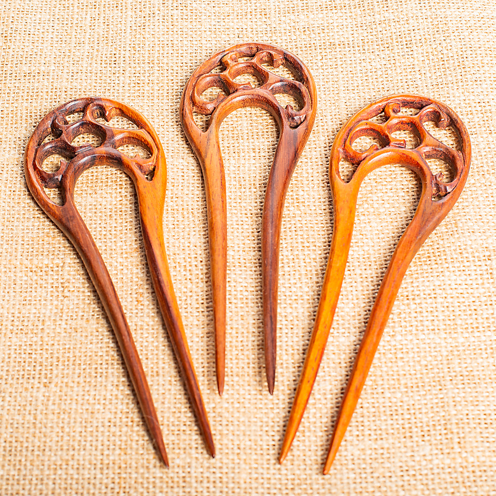 wooden double prong hair stick with tree branch motif carved at end
