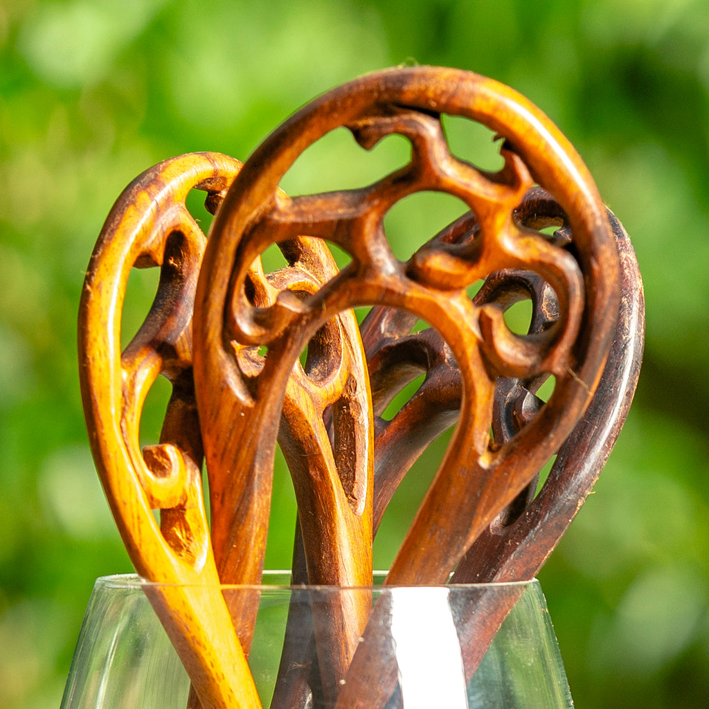 wooden double prong hair stick with tree branch motif carved at end detail