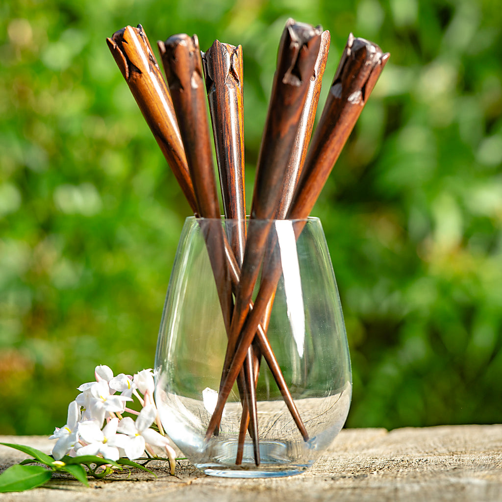 hand carved conical wooden hairstick with rose flower bud at end