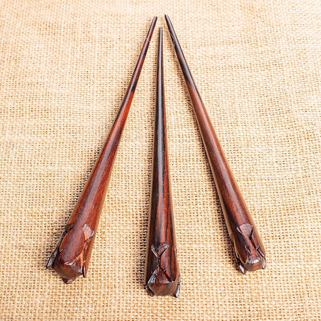 hand carved conical wooden hairstick with rose flower bud at end