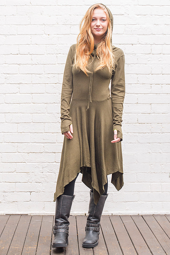 Model wearing a skadi midi length handkerchief hemline knit dress with hoodie and thumbholes in army green from front