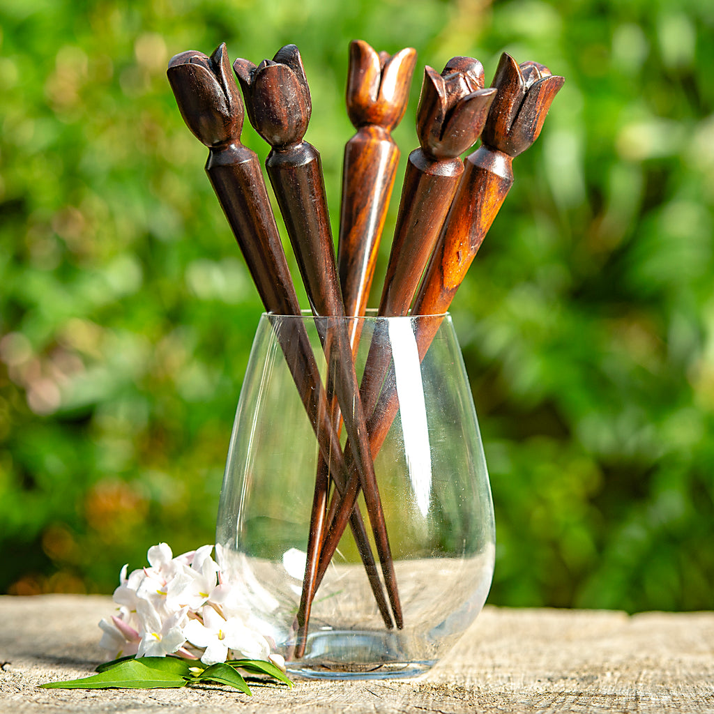 thin cone shaped wooden hair stick with naive tulip shaped flower carved at end