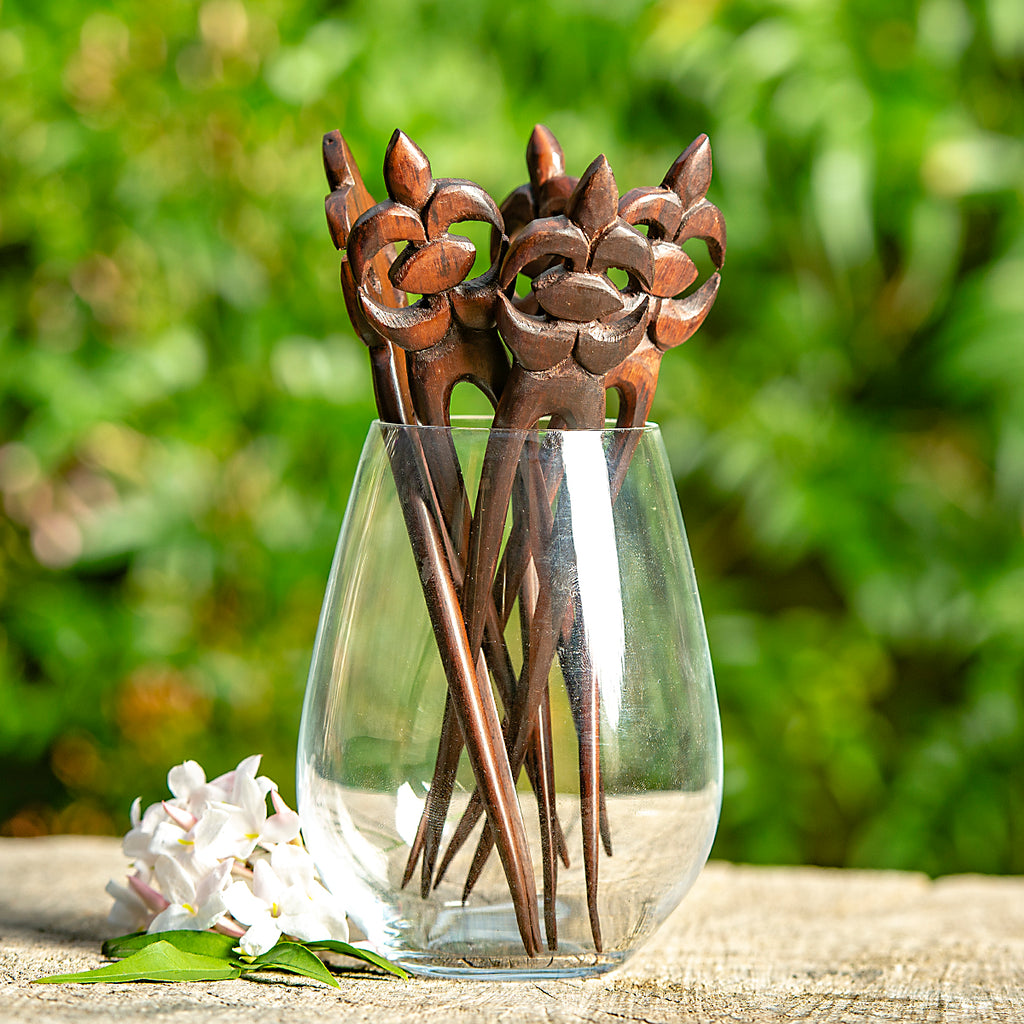 hand made wooden double prong hair stick with naive stylised sea turtle carved at end