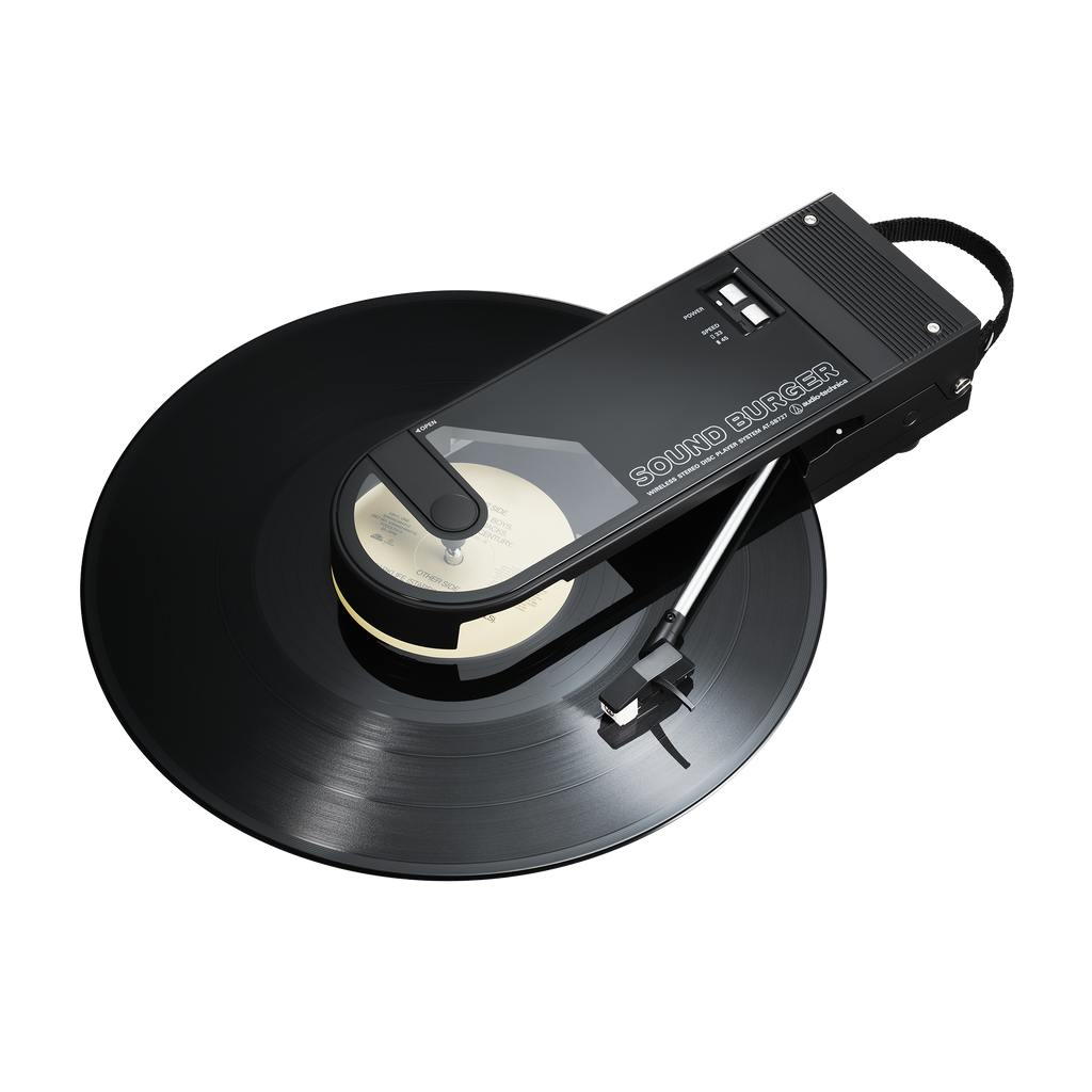 Audio Technica sound burger at-sb727 portable usb and bluetooth turntable in black from above front three quarter with record playing