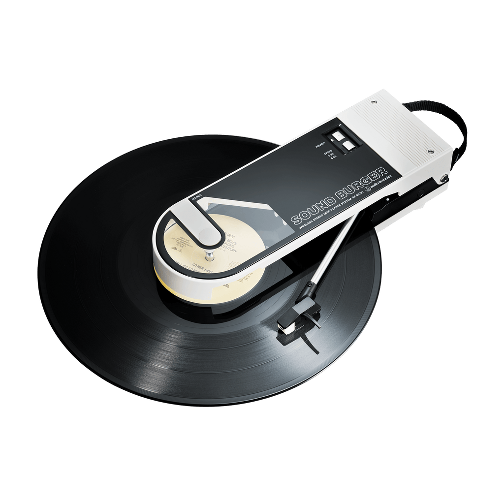 Audio Technica sound burger at-sb727 portable usb and bluetooth turntable in white from above front three quarter with record playing