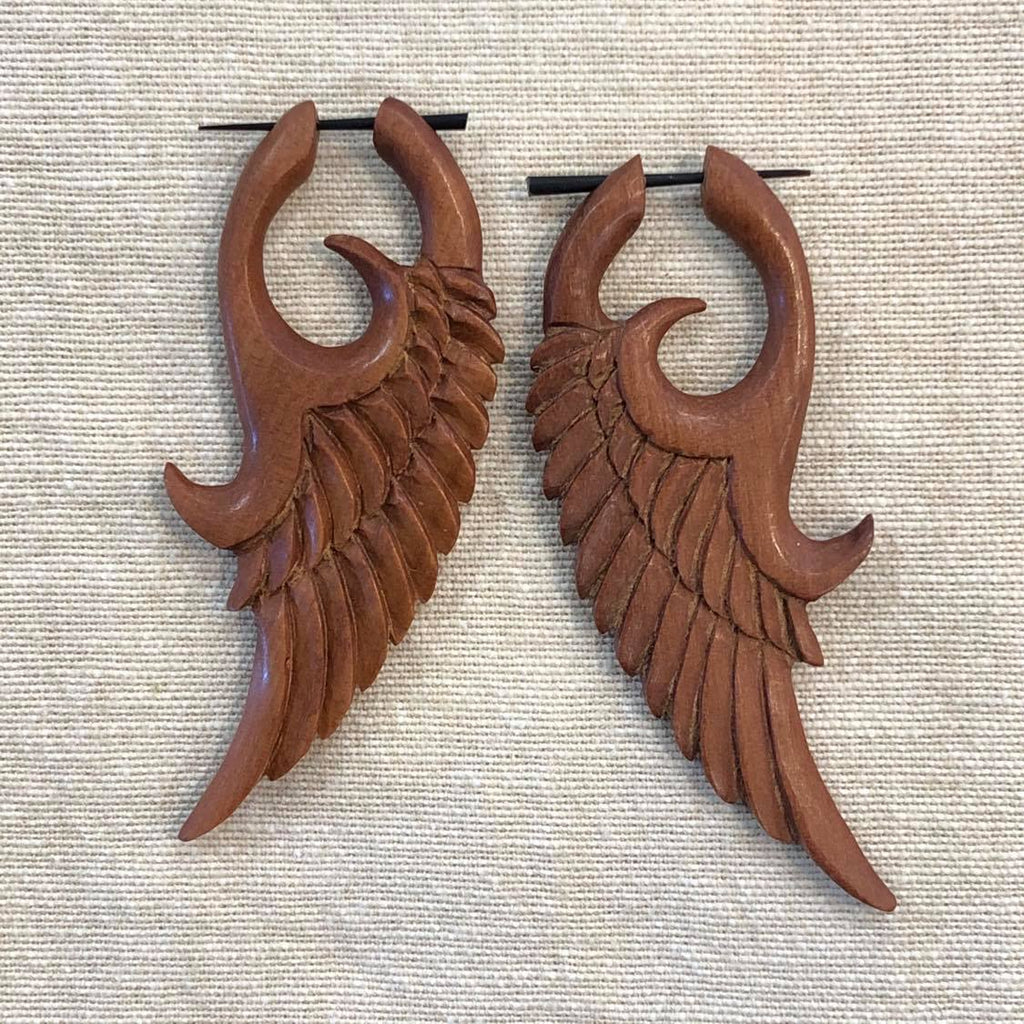 Two Rosewood earrings featuring a feather design
