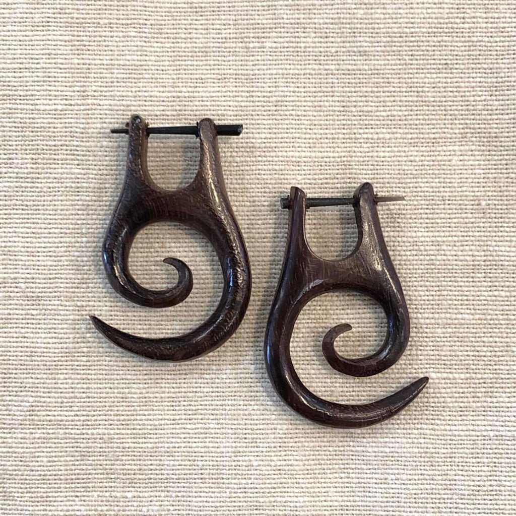 Two rosewood earrings featuring a spiral shape design