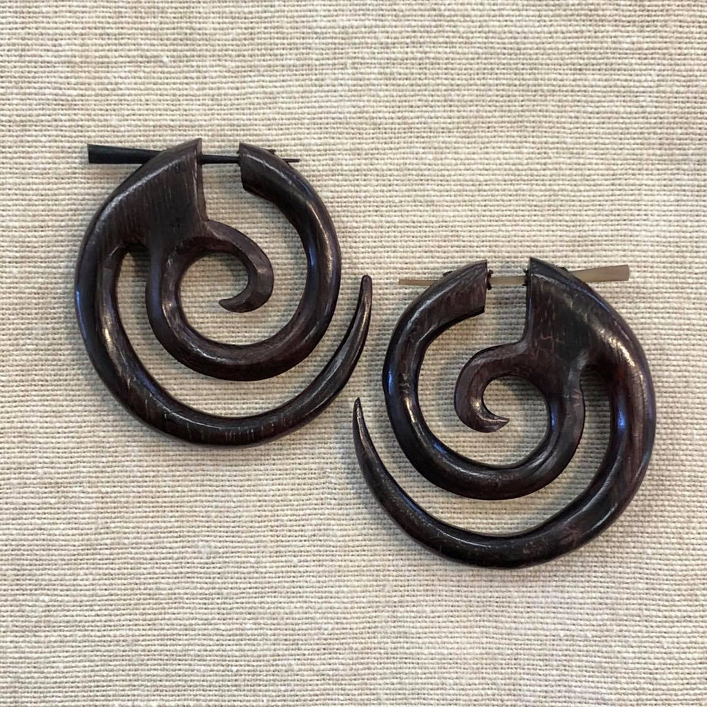 Two rosewood round earrings featuring a spiral design
