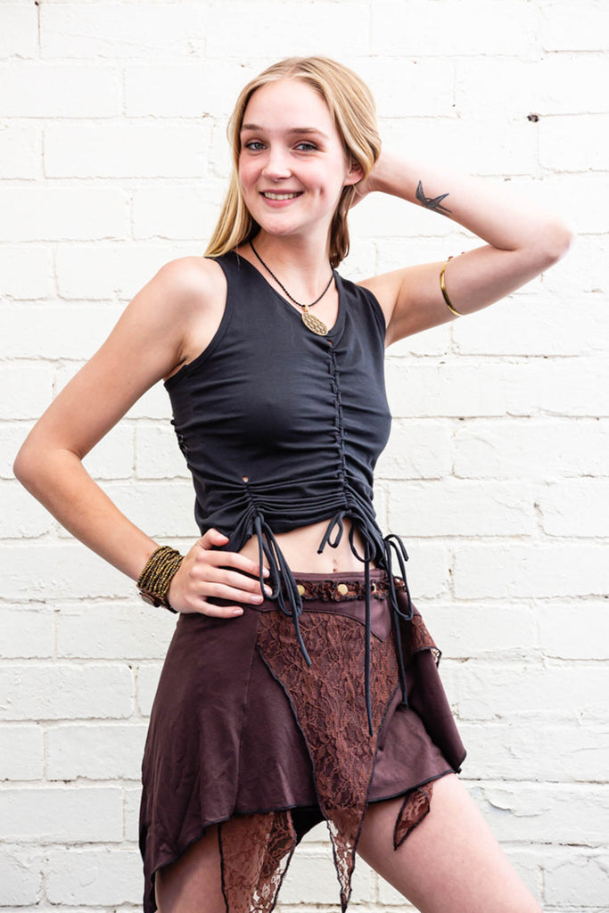 Spirit weaver Skirt in brown with layered multi-textured fabric and triangular lace adornments side